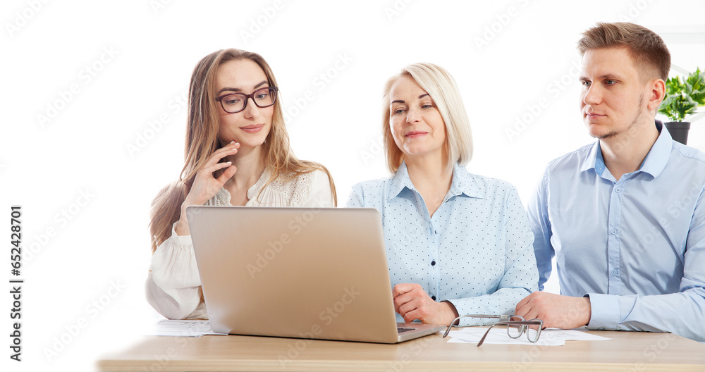 An adept businesswoman is providing guidance and teaching to junior workers in the office. Selective focus. An adept businesswoman is providing guidance and teaching to junior workers in the office. Selective focus.