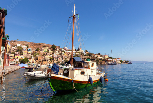 Colorful traditional fishing boats in the bay of Symi island.