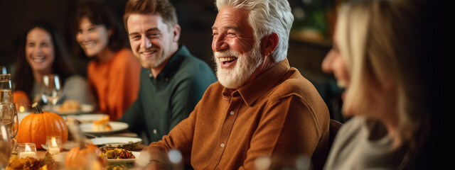 Portrait of a man during Thanksgiving dinner with his family