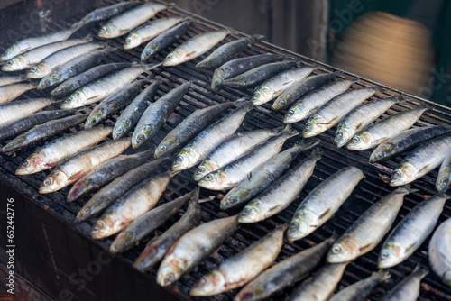 grilling sardines outdoor on the street in Porto Portugal