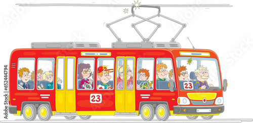 Red tramway with a smiling driver and a noisy company of funny passengers with their things riding along a city street, vector cartoon illustration isolated on a white background