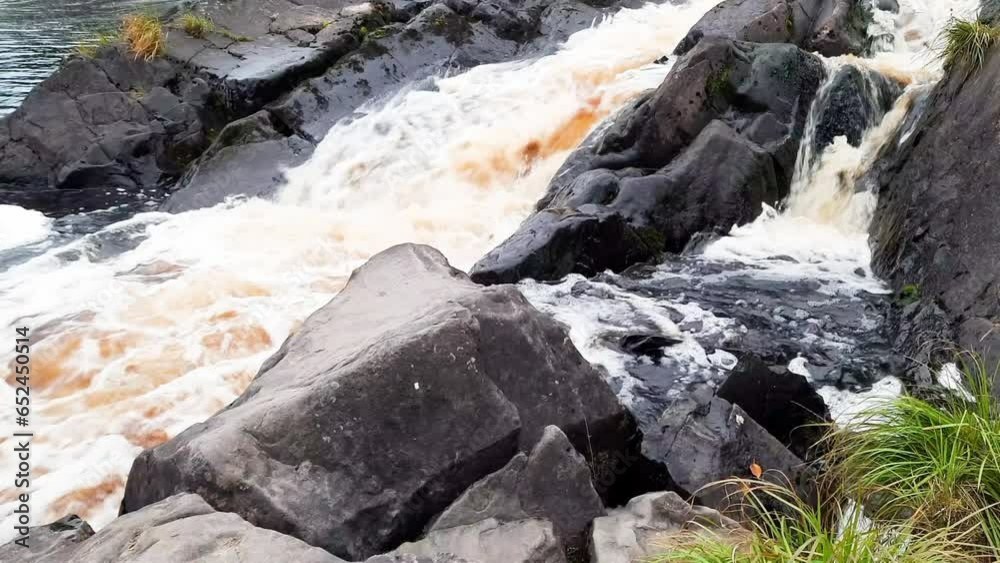 Beautiful waterfall among the stones. Karelia. Russia. Beautiful waterfall among the stones. Karelia. Russia.