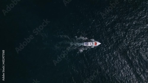 Wallpaper Mural Aerial view of a pleasure boat racing through the sea waves, creating a mesmerizing picture of speed and freedom. Torontodigital.ca