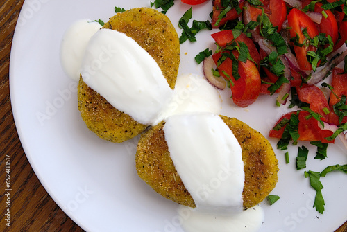 broccoli potato rissoles with sour cream and tomato salad