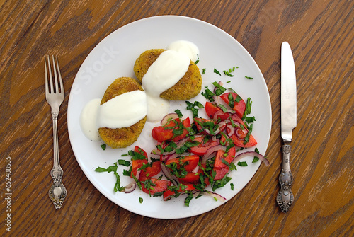 broccoli potato rissoles with sour cream and tomato salad