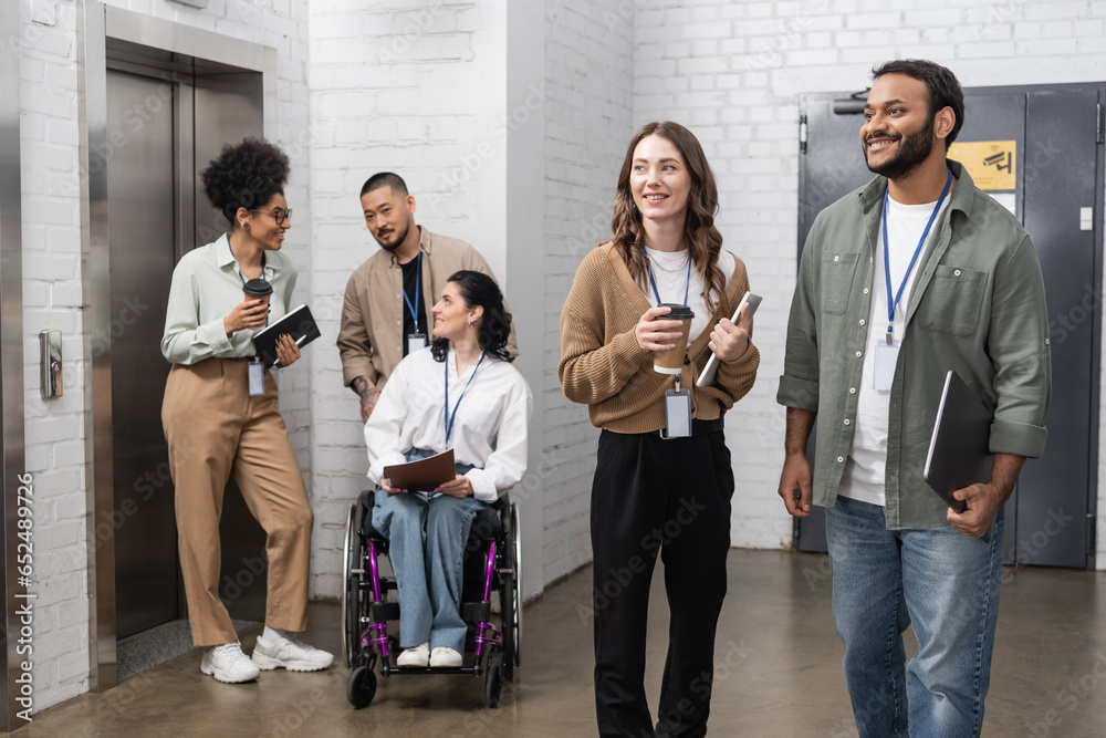 Fototapeta premium inclusion and diversity, multiethnic creative team standing together neat office elevators in hall