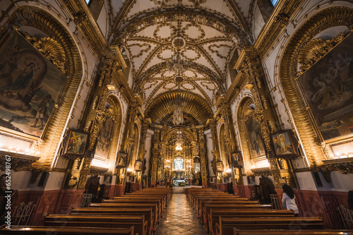 Beautiful church of Santa Isabel seen from the interior with gold details, located in the City of Tlaxcala, Mexico photo