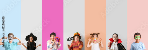 Set of different little children dressed for Halloween on color background