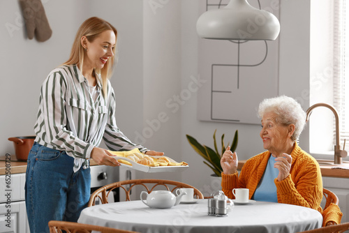 Young woman with baked croi...
