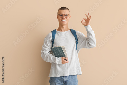 Happy male student in eyegl...