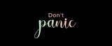 Don't panic handwritten slogan on dark background. Brush calligraphy banner. Illustration quote for banner, card or t-shirt print design. Relax and chill, message inspiration. Aesthetic design.