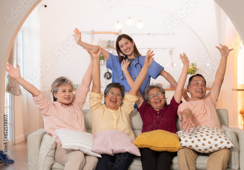 Group of Asian senior and caregiver having fun in the nursing home.