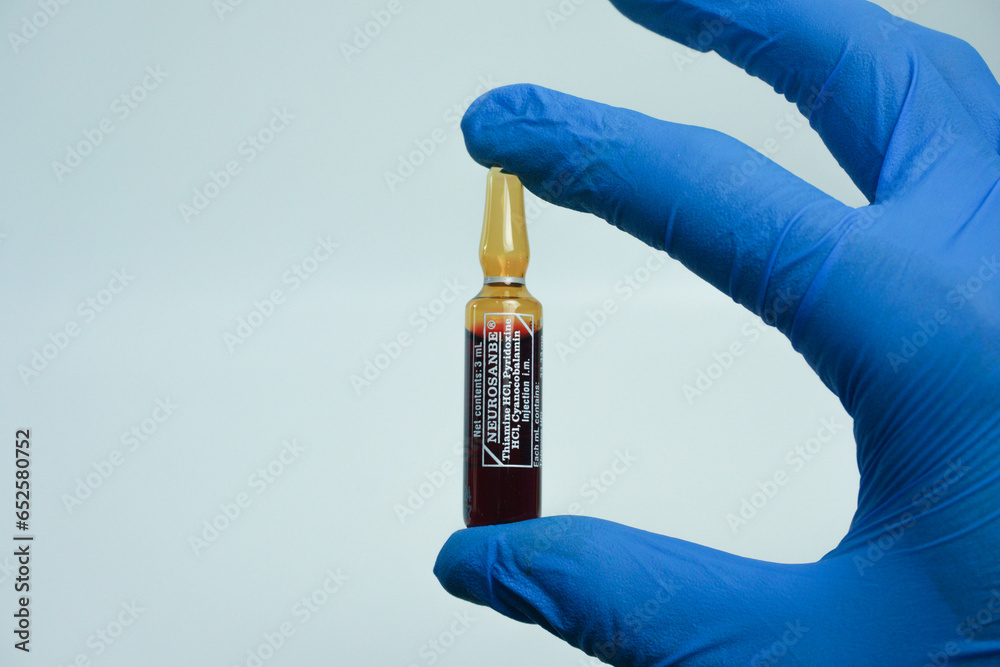 Balikpapan, June 1 2023. Holding a neurobion ampoule using medical