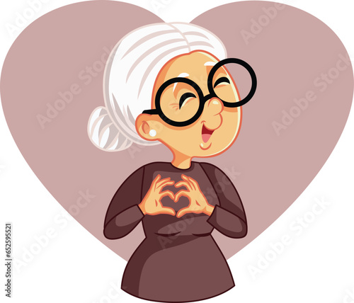 Elderly Senior Woman Making a Heart Gesture with her Hands Vector Cartoon. Old granny making a caring affectionate sign showing love 
