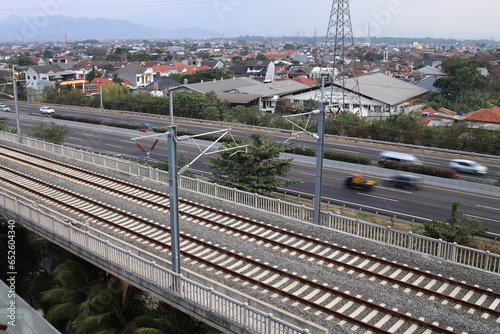 Bandung, Indonesia - 24 September 2023: Aerial view railroad tracks for Kereta Cepat Jakarta Bandung (KCJB) atau Comprehensive Inspection Train (CIT)  photo