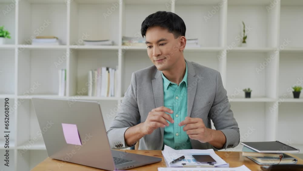 Asian businessman Fatigue from working for a long time While working on a laptop, tired, hand pain at the office Feeling sick at work. Asian businessman Fatigue from working for a long time While working on a laptop, tired, hand pain at the office Feeling sick at work.