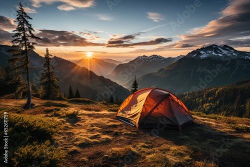 Elevated Adventure: A Camping Tent Set Amidst the Mountain Peaks at Sunset