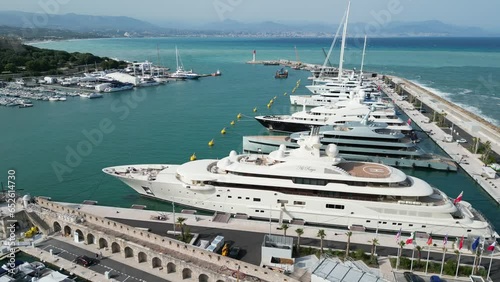 Superyachts moored at Cannes France drone, aerial slow panning shot photo