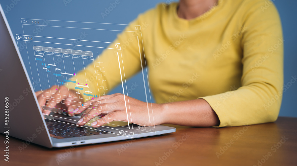 Analyst working with computer in Business Analytics and Data Management ...