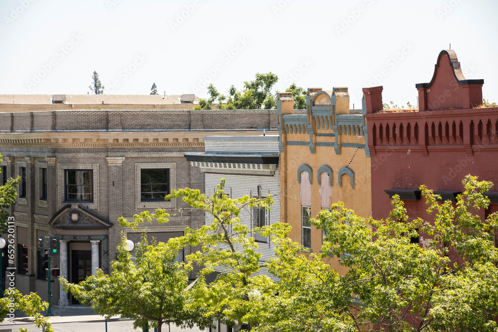 Lodi, California, USA - July 16, 2021: Sunlight shines on the historic downtown buildings of Lodi.