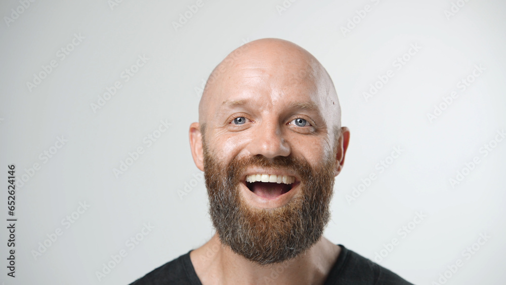 Handsome person look at camera close up. Young adult man face portrait. Stylish 30s guy on isolated white background. Attractive male model. Modern millennial people. Brutal bearded style. Barber shop - obrazy, fototapety, plakaty 