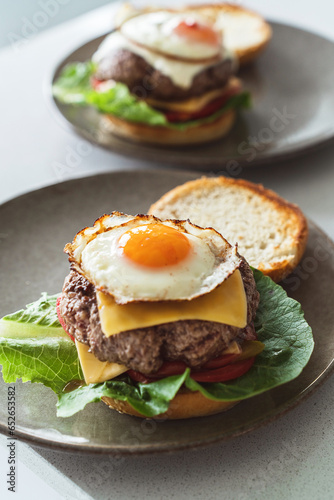 Delectable homemade cheeseburger garnished with a perfectly fried sunny-side-up egg