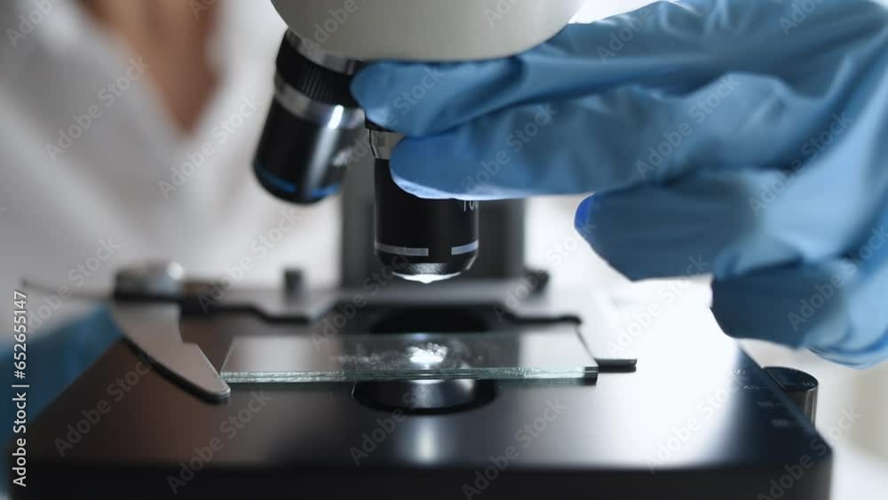 Medical laboratory, scientist hands using microscope for examining ...
