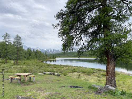 Picnic place on the shore of a mountain lake in Mountain Altai.