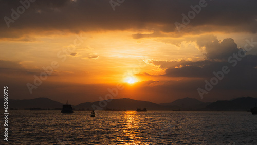 beautiful sunset at the sea horizon, sun in the middle  