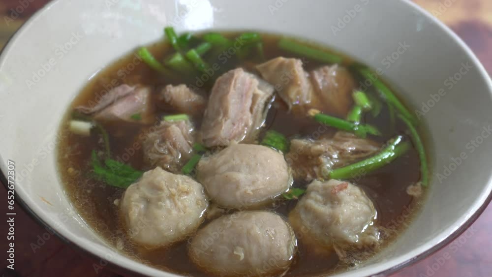 Tasty Thai meatball soup with green vegetable in bowl point of view shot. Food concept Tasty Thai meatball soup with green vegetable in bowl point of view shot. Food concept
