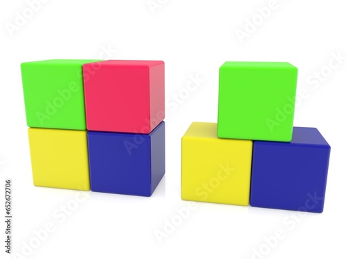 Colorful toy cubes stacked in two piles