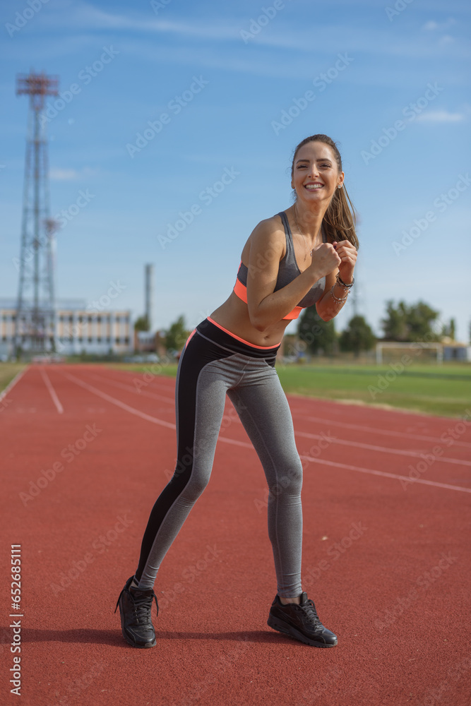 Beautiful woman training on the tracks on a sunny morning Beautiful woman training on the tracks on a sunny morning