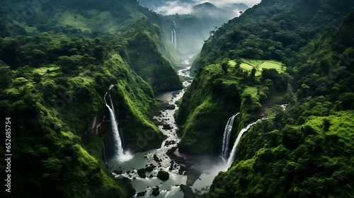 Stunning aerial view: cascading waterfalls amidst lush forest