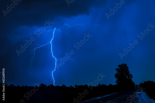 lightning in the night with blue sky