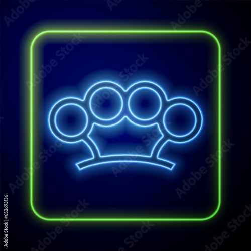 Glowing neon Brass knuckles icon isolated on blue background. Vector