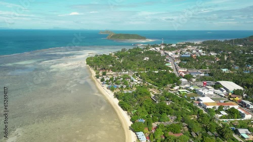 Koh Phangan Island aerial shot with Thongsala Pier, ko tae nai island, and Koh Tau Island, drone shot orbital photo