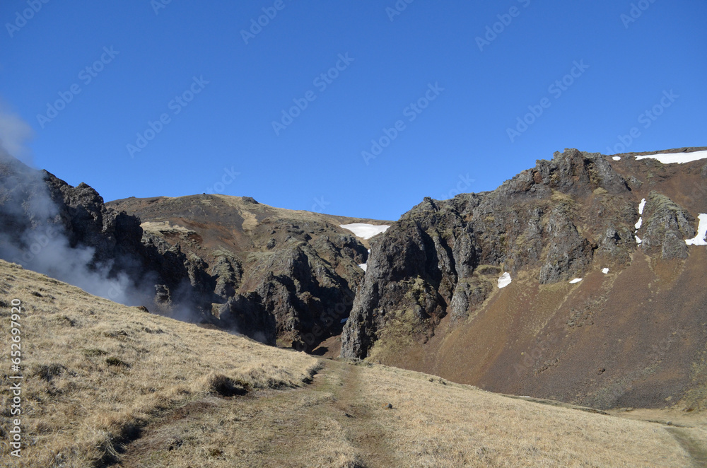 Volcanic Barren Landscape with Rolling Hills and a Valley Volcanic Barren Landscape with Rolling Hills and a Valley