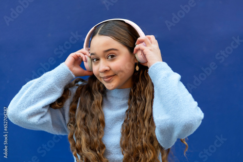 young girl using her headphones