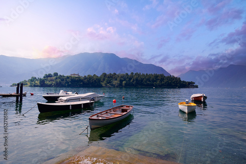 Fototapeta Naklejka Na Ścianę i Meble -  Beautiful scene of boats on lake Como in Italy. A big blue lake surrounded by green hills