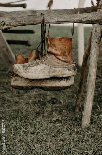 boots on a fence
