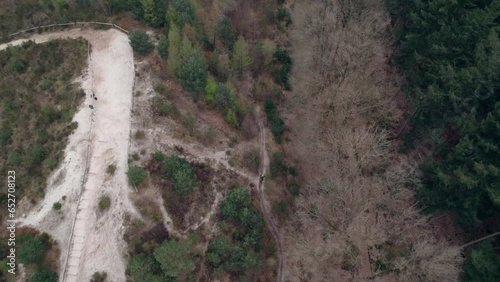 Top Down View Of Motorcycle Traveling On Mountain Road In Gasselte, Groningen, Netherlands - drone shot photo