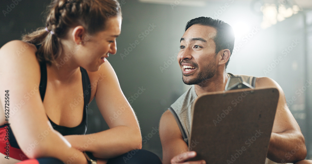 Man, woman and clipboard with talking in gym, sign up and planning for ideas, workout and smile with info. Personal trainer, paperwork and client for fitness, checklist and recruitment for wellness - obrazy, fototapety, plakaty 