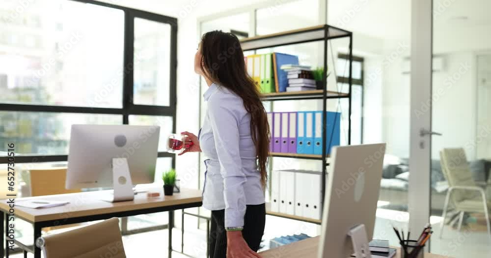 Walking coffee and ambition with a business woman in office at work for growth or development. Success mission and vision with female employee walking working Walking coffee and ambition with a business woman in office at work for growth or development. Success mission and vision with female employee walking working