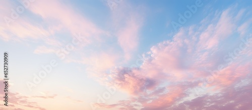Dawn or sunset sky with pastel light cirrus clouds