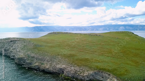 Flight over land and water. Russia, Baikal, Bay Small Sea. Island Kharantsy. Near Olkhon Island, From Drone