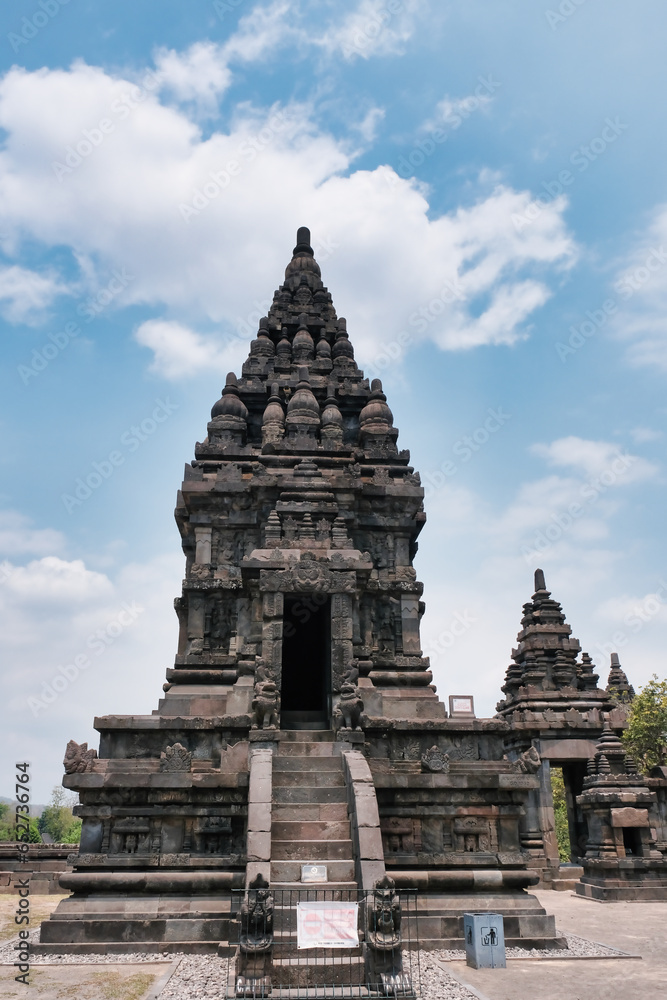 Candi Syiwa is one little tower of Prambanan temple in Yogyakarta under blue sunny day