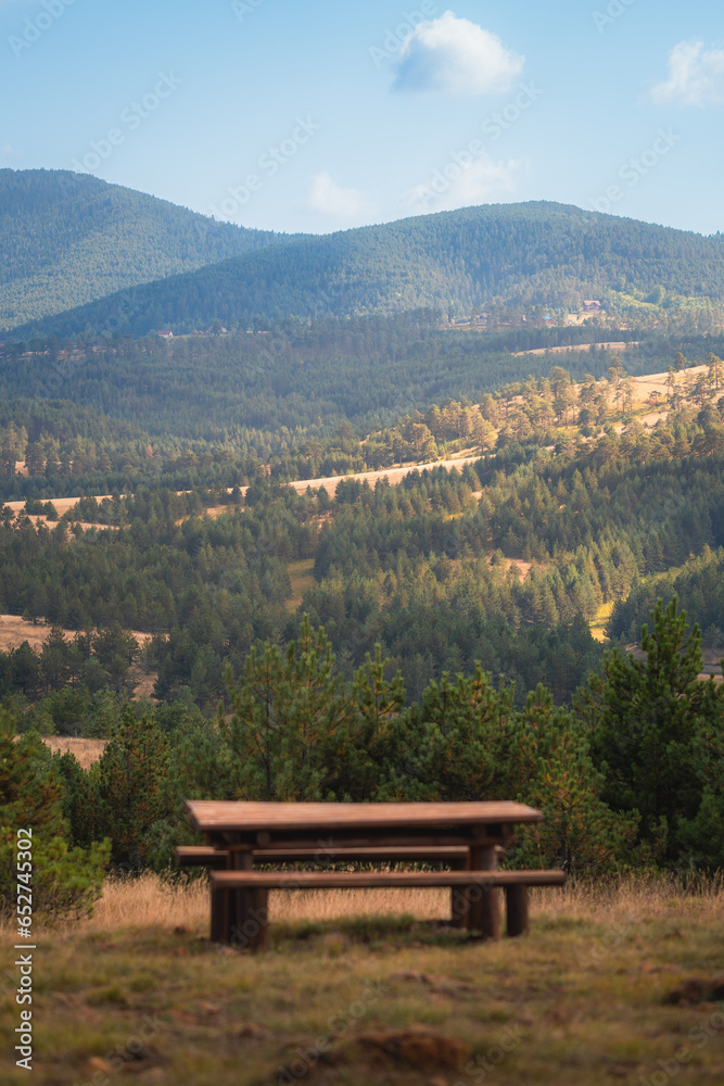 Picnic and rest area for tourists, wooden table and benches Picnic and rest area for tourists, wooden table and benches