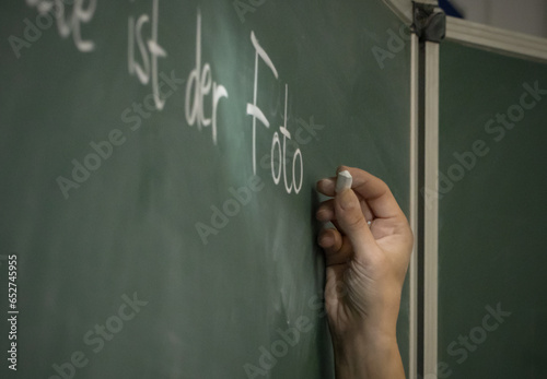 hand writing on a blackboard