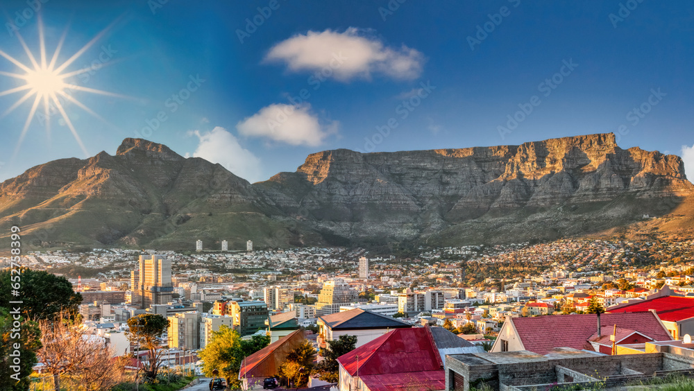 Fototapeta premium table mountain in cape town, aerial view over residential neighborhood, at sunset