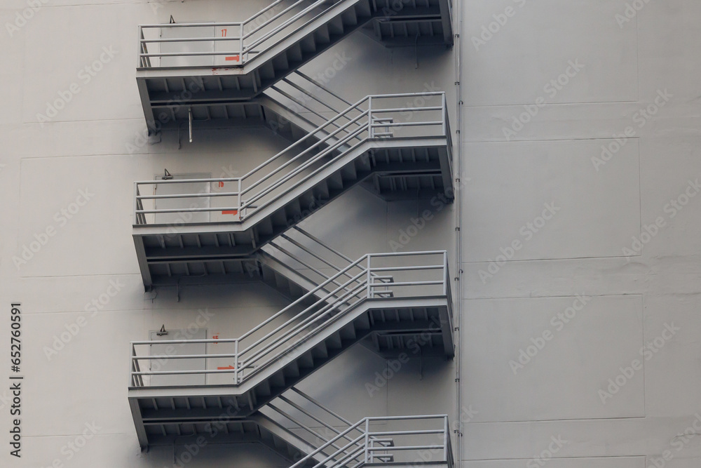 fire escape stair steel. grey outdoor metal stair of the high building. - obrazy, fototapety, plakaty 